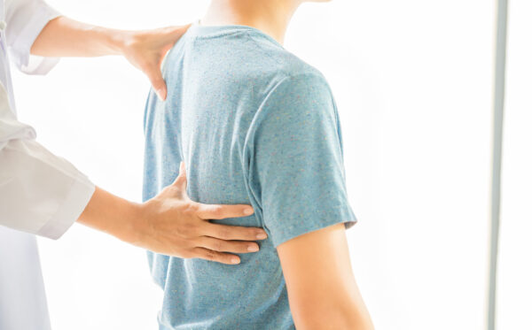 Physical therapists are examining the patient's body.