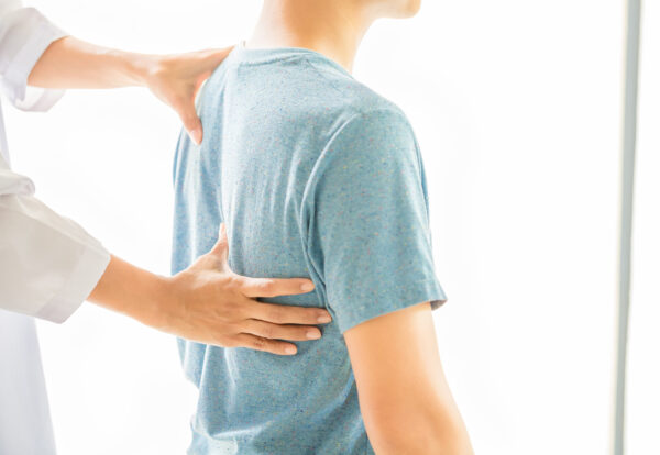 Physical therapists are examining the patient's body.